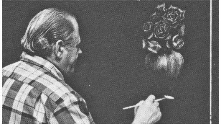 bill at the easel painting a vase of roses on a black canvas
